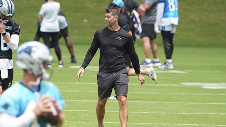 Jun 4, 2024; Charlotte, NC, USA; Carolina Panthers Head Coach Dave Canales looks at his offensive backfield during OTAs. Mandatory Credit: Jim Dedmon-USA TODAY Sports