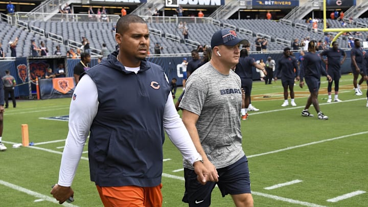 Aug 26, 2023; Chicago, Illinois, USA;  Chicago Bears General Manager Ryan Poles, left, and Luke Getsy, Offensive Coordinator walk the field  before the team s game against the Buffalo Bills at Soldier Field. Mandatory Credit: Matt Marton-Imagn Images