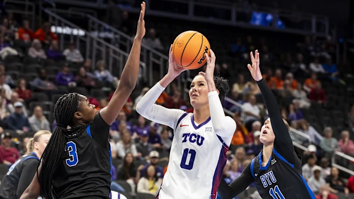Mar 6, 2026; Kansas City, MO, USA; TCU Horned Frogs center Kennedy Basham (0) attempt a shot over BYU Cougars forward Bolanle Yussuf (3) during the first half at T-Mobile Center. Mandatory Credit: Nick Tre. Smith-Imagn Images