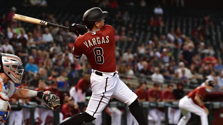 Jun 2, 2021; Phoenix, Arizona, USA; Arizona Diamondbacks infielder Ildemaro Vargas (8) hits a two-RBI single in the first inning against the New York Mets at Chase Field. Mandatory Credit: Matt Kartozian-Imagn Images