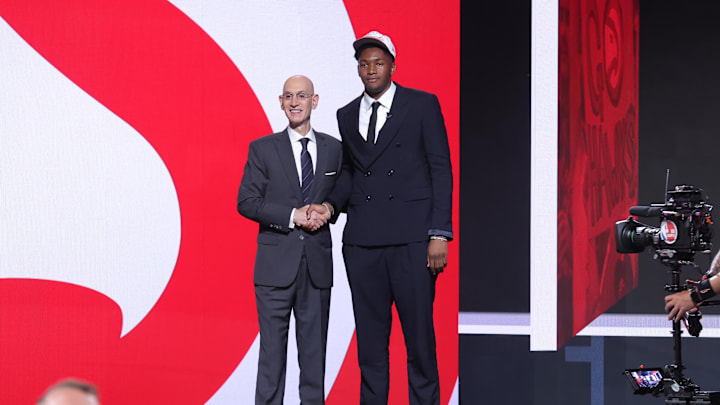 Jun 25, 2025; Brooklyn, NY, USA; Derik Queen stands with NBA commissioner Adam Silver after being selected as the 13th pick by the Atlanta Hawks in the first round of the 2025 NBA Draft at Barclays Center. Mandatory Credit: Brad Penner-Imagn Images Jun 25, 2025; Brooklyn, NY, USA; Derik Queen stands with NBA commissioner Adam Silver after being selected as the 13th pick by the Atlanta Hawks in the first round of the 2025 NBA Draft at Barclays Center. Mandatory Credit: Brad Penner-Imagn Images