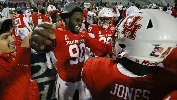 Dec 23, 2022; Shreveport, Louisiana, USA; Houston Cougars defensive linemen Zykeius Strong (90) reacts with Houston Cougars defensive linemen D'Anthony Jones (44) after defeating the Louisiana-Lafayette Ragin' Cajuns the in the 2022 Independence Bowl at Independence Stadium. Mandatory Credit: Petre Thomas-Imagn Images Dec 23, 2022; Shreveport, Louisiana, USA; Houston Cougars defensive linemen Zykeius Strong (90) reacts with Houston Cougars defensive linemen D'Anthony Jones (44) after defeating the Louisiana-Lafayette Ragin' Cajuns the in the 2022 Independence Bowl at Independence Stadium. Mandatory Credit: Petre Thomas-Imagn Images
