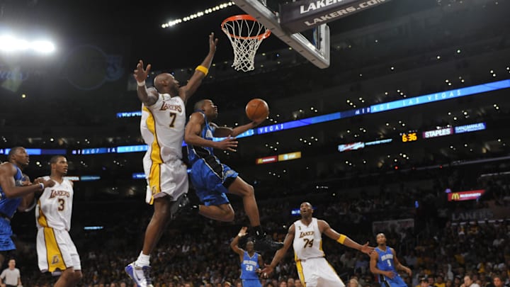 Jun 7, 2009; Los Angeles, CA, USA; Orlando's Rafer Alston drives for a layup against Lakers Lamar Odom during game two of the NBA Finals. Los Angeles Lakers host the Orlando Magic at the Staples Center in Los Angeles, CA. Mandatory Credit: Robert Hanashiro-USA TODAY