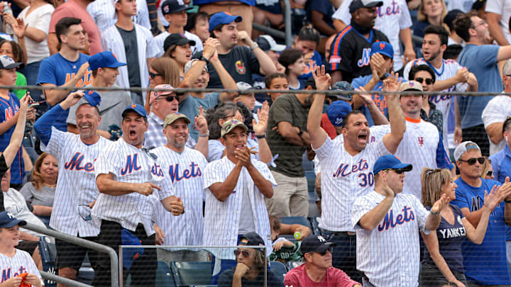 Jul 4, 2021; Bronx, New York, USA; New York Mets fans celebrate during the seventh inning of the