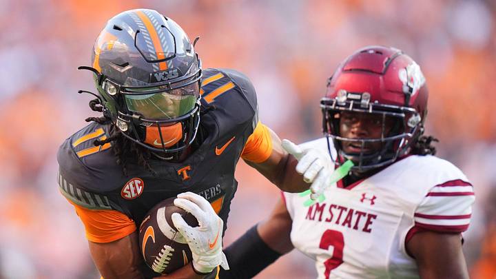 Tennessee running back Peyton Lewis (2) moves the ball while guarded by New Mexico State safety Armahn Hale (2) during an NCAA college football game on November 15, 2025, in Knoxville, Tenn. Tennessee running back Peyton Lewis (2) moves the ball while guarded by New Mexico State safety Armahn Hale (2) during an NCAA college football game on November 15, 2025, in Knoxville, Tenn.