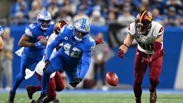 Jan 18, 2025; Detroit, Michigan, USA; Detroit Lions linebacker Jalen Reeves-Maybin (42) and Washington Commanders tight end Zach Ertz (86) battle for a onside kick recovery fourth quarter in a 2025 NFC divisional round game at Ford Field. Mandatory Credit: Lon Horwedel-Imagn Images