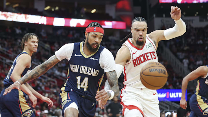 Jan 31, 2024; Houston, Texas, USA; New Orleans Pelicans forward Brandon Ingram (14) and Houston Rockets forward Dillon Brooks (9) attempt to get a loose ball during the game at Toyota Center. Mandatory Credit: Troy Taormina-Imagn Images Jan 31, 2024; Houston, Texas, USA; New Orleans Pelicans forward Brandon Ingram (14) and Houston Rockets forward Dillon Brooks (9) attempt to get a loose ball during the game at Toyota Center. Mandatory Credit: Troy Taormina-Imagn Images