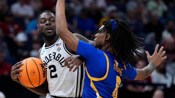 Vanderbilt Commodores guard Duke Miles (2) tries to get past McNeese Cowboys guard Tyshawn Archie (8) during a first-round game in the NCAA men's basketball tournament between McNeese and Vanderbilt at Paycom Center in Oklahoma City, Thursday, March 19, 2026.