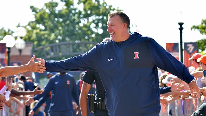 Aug 29, 2025; Champaign, Illinois, USA;  Illinois Fighting Illini head coach Bret Bielema leads his team during the Illini Walk before an NCAA football game against the Western Illinois Leathernecks at Memorial Stadium. Mandatory Credit: Ron Johnson-Imagn Images