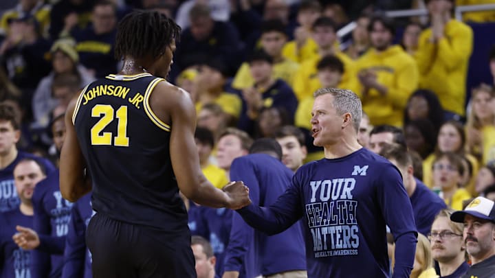Jan 27, 2026; Ann Arbor, Michigan, USA; Michigan Wolverines head coach Dusty May talks to forward Morez Johnson Jr. (21) in the first half at Crisler Center. Mandatory Credit: Rick Osentoski-Imagn Images Jan 27, 2026; Ann Arbor, Michigan, USA; Michigan Wolverines head coach Dusty May talks to forward Morez Johnson Jr. (21) in the first half at Crisler Center. Mandatory Credit: Rick Osentoski-Imagn Images