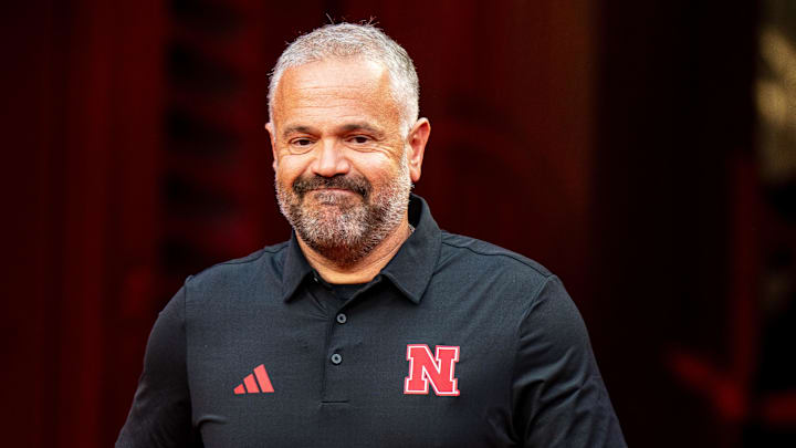 Aug 28, 2025; Kansas City, Missouri, USA; Nebraska Cornhuskers head coach Matt Rhule walks onto the field during warmups before the game against the Cincinnati Bearcats at GEHA Field at Arrowhead Stadium. Mandatory Credit: Dylan Widger-Imagn Images