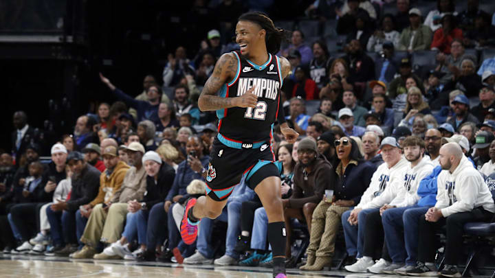 Nov 9, 2025; Memphis, Tennessee, USA; Memphis Grizzlies guard Ja Morant (12) reacts after a basket during the second quarter against the Oklahoma City Thunder at FedExForum. Mandatory Credit: Petre Thomas-Imagn Images