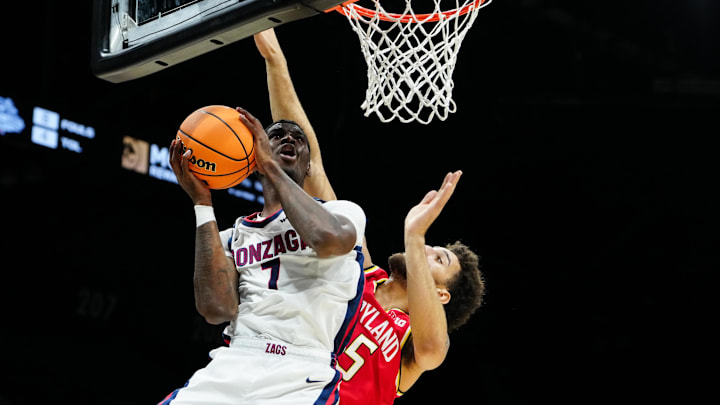 Nov 25, 2025; Las Vegas, NV, USA; Gonzaga Bulldogs guard Tyon Grant-Foster (7) drives past Maryland Terrapins center Collin Metcalf (45) in the first half in a 2025 Players Era Festival group play game at MGM Grand Garden Arena. 