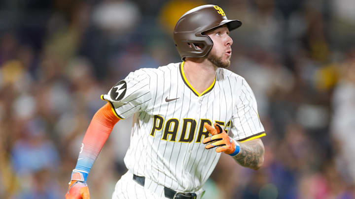 Jul 5, 2025; San Diego, California, USA; San Diego Padres center fielder Jackson Merrill (3) hits a sacrifice fly during the seventh inning against the Texas Rangers at Petco Park. Mandatory Credit: David Frerker-Imagn Images