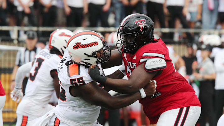 Sep 13, 2025; Lubbock, Texas, USA;   Oregon State Beavers offensive lineman Van Wells (55) blocks Texas Tech Red Raiders defensive guard Lee Hunter (2) in the first half at Jones AT&T Stadium. Mandatory Credit: Michael C. Johnson-Imagn Images