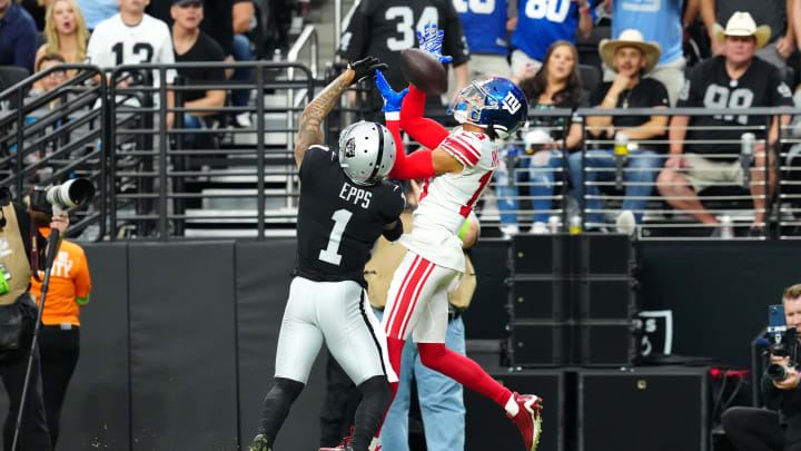 Nov 5, 2023; Paradise, Nevada, USA; New York Giants wide receiver Jalin Hyatt (13) attempts to make a catch with Las Vegas Raiders safety Marcus Epps (1) defending during the first quarter at Allegiant Stadium. Mandatory Credit: Stephen R. Sylvanie-USA TODAY Sports