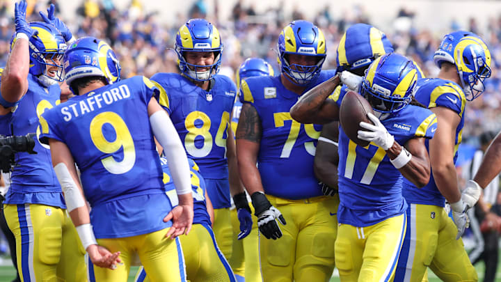 Nov 2, 2025; Inglewood, California, USA; Los Angeles Rams wide receiver Davante Adams (17) reacts with quarterback Matthew Stafford (9) and  teammates after catching a touchdown against the New Orleans Saints during the first half at SoFi Stadium. Mandatory Credit: Kiyoshi Mio-Imagn Images