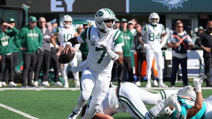 Oct 25, 2026; East Rutherford, New Jersey, USA;  New York Jets quarterback Geno Smith (7) scrambles against the Miami Dolphins during the first half at MetLife Stadium.  Mandatory Credit: Robert Deutsch-Imagn Images