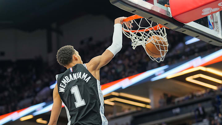 Feb 27, 2024; Minneapolis, Minnesota, USA; San Antonio Spurs center Victor Wembanyama (1) dunks against the Minnesota Timberwolves in the fourth quarter at Target Center.