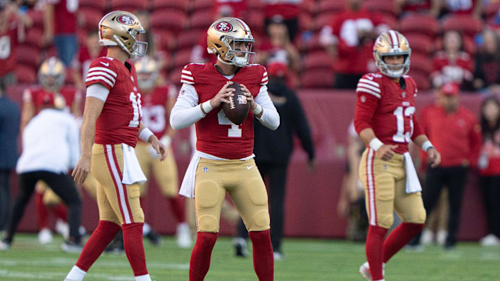 Aug 25, 2023; Santa Clara, California, USA; San Francisco 49ers quarterbacks Brock Purdy (13), Sam Darnold (14) and Brandon Allen (4) warm up before the start of the first quarter against the Los Angeles Chargers at Levi's Stadium. Mandatory Credit: Stan Szeto-Imagn Images