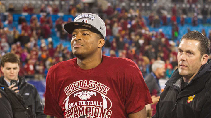 Dec 6, 2014; Charlotte, NC, USA; Florida State Seminoles quarterback Jameis Winston (5) walks off the field after defeating the Georgia Tech Yellow Jackets at Bank of America Stadium. FSU defeated Georgia Tech 37-35. Mandatory Credit: Jeremy Brevard-Imagn Images