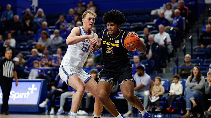 Jan 11, 2025; Colorado Springs, Colorado, USA; San Jose State Spartans center Robert Vaihola (22) controls the ball as Air Force Falcons center Wesley Celichowski (51) guards in the first half at Clune Arena. Mandatory Credit: Isaiah J. Downing-Imagn Images