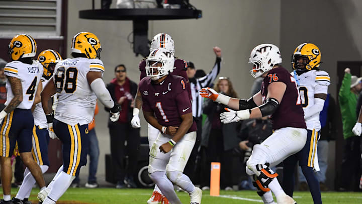 Oct 24, 2025; Blacksburg, Va,; Virginia Tech quarterback Kyron Drones (1) and offensive lineman Aidan Lynch (76) celebrate a touchdown vs. California. Oct 24, 2025; Blacksburg, Va,; Virginia Tech quarterback Kyron Drones (1) and offensive lineman Aidan Lynch (76) celebrate a touchdown vs. California.