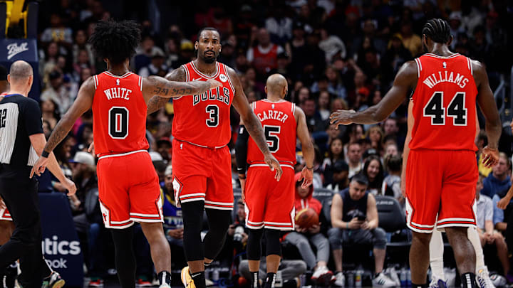 Oct 15, 2023; Denver, Colorado, USA; Chicago Bulls center Andre Drummond (3) reacts with guard Coby White (0) and forward Patrick Williams (44) in the third quarter against the Denver Nuggets at Ball Arena. Mandatory Credit: Isaiah J. Downing-Imagn Images