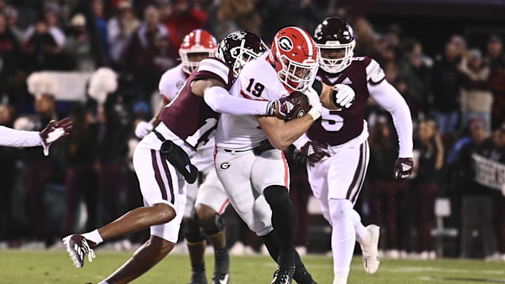 Nov 12, 2022; Starkville, Mississippi, USA; Georgia Bulldogs tight end Brock Bowers (19) runs the ball against Mississippi State Bulldogs safety Collin Duncan (19) during the first quarter at Davis Wade Stadium at Scott Field. Mandatory Credit: Matt Bush-Imagn Images