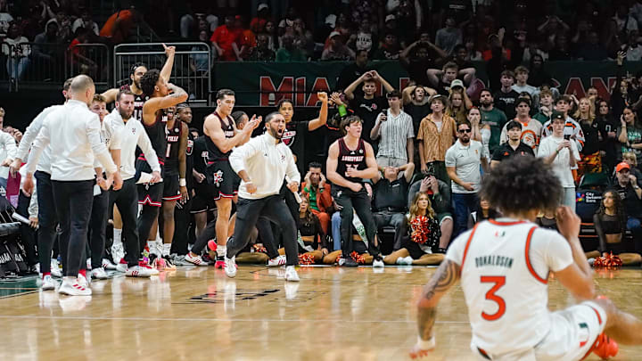 Mar 7, 2026; Coral Gables, Florida, USA; Louisville Cardinals players and coaches react in a game against the Miami Hurricanes during the second half at Watsco Center. Mandatory Credit: Jeff Romance-Imagn Images