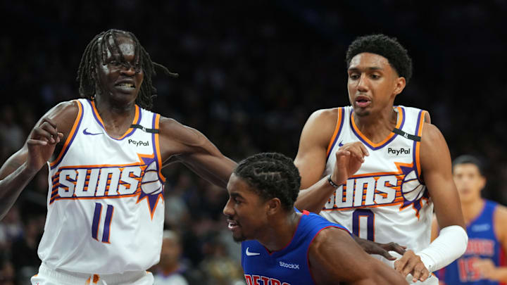 Oct 11, 2024; Phoenix, Arizona, USA; Phoenix Suns center Bol Bol (11) and Phoenix Suns forward Ryan Dunn (0) guard Detroit Pistons guard Jaden Ivey (23) during the second half at Footprint Center. Mandatory Credit: Joe Camporeale-Imagn Images