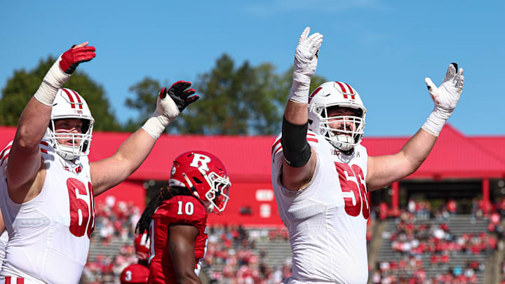 Wisconsin offensive linemen Joe Brunner (56) and Joe Huber celebrate after a touchdown during the first half against Rutgers at SHI Stadium in Piscataway, N.J. on Oct. 12, 2024. 