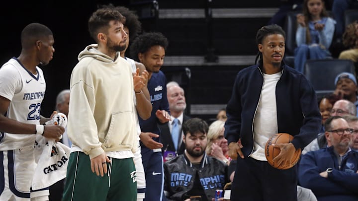 Nov 24, 2025; Memphis, Tennessee, USA; Memphis Grizzlies guard Ty Jerome (left) and guard Ja Morant (right) looks on during the second quarter against the Denver Nuggets at FedExForum. Mandatory Credit: Petre Thomas-Imagn Images