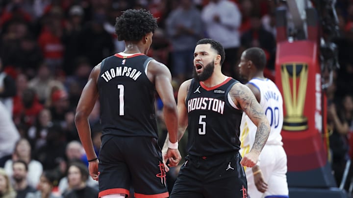 Dec 11, 2024; Houston, Texas, USA; Houston Rockets guard Fred VanVleet (5) reacts with forward Amen Thompson (1) after a play during the second quarter against the Golden State Warriors at Toyota Center. Mandatory Credit: Troy Taormina-Imagn Images