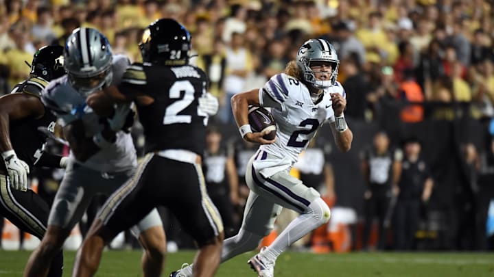 Oct 12, 2024; Boulder, Colorado, USA; Kansas State Wildcats quarterback Avery Johnson (2) scrambles out of the pocket during the first half against the Colorado Buffaloes at Folsom Field. Mandatory Credit: Christopher Hanewinckel-Imagn Images