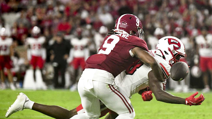 Aug 31, 2024; Tuscaloosa, Alabama, USA;  Alabama Crimson Tide defensive back Jaylen Mbakwe (9) breaks up a pass intended for Western Kentucky Hilltoppers Hilltoppers  wide receiver Moussa Barry (18) at Bryant-Denny Stadium. Mandatory Credit: Gary Cosby Jr.-Imagn Images