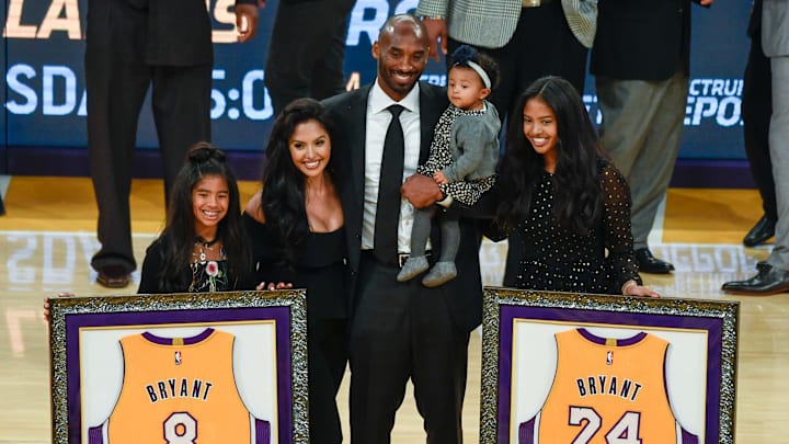 Dec 18, 2017; Los Angeles, CA, USA; Kobe Bryant (center) poses with his family Gianna Bryant, Vanessa Bryant, Bianka Bryant, and Natalia Bryant during a halftime ceremony retiring Kobe Bryant's two uniform numbers at Staples Center. Mandatory Credit: Robert Hanashiro-Imagn Images Dec 18, 2017; Los Angeles, CA, USA; Kobe Bryant (center) poses with his family Gianna Bryant, Vanessa Bryant, Bianka Bryant, and Natalia Bryant during a halftime ceremony retiring Kobe Bryant's two uniform numbers at Staples Center. Mandatory Credit: Robert Hanashiro-Imagn Images