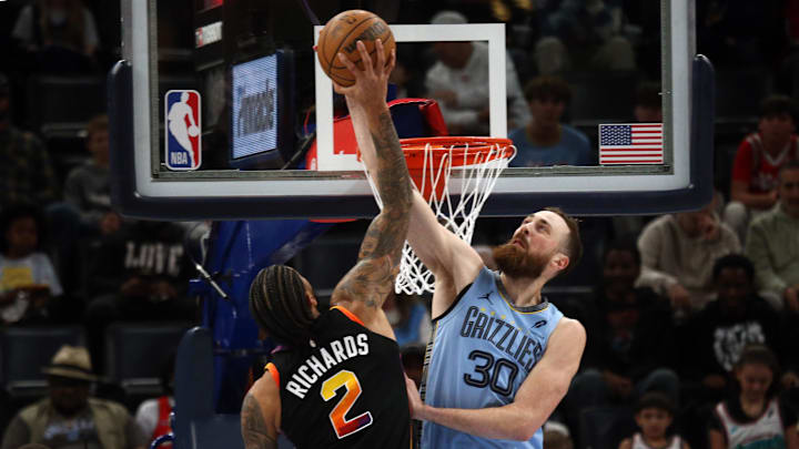IMar 10, 2025; Memphis, Tennessee, USA; Memphis Grizzlies center Jay Huff (30) blocks the shot attempt by Phoenix Suns center Nick Richards (2) during the first quarter at FedExForum. Mandatory Credit: Petre Thomas-Imagn Images