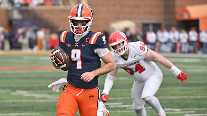 Nov 1, 2025; Champaign, Illinois, USA;  Illinois Fighting Illini quarterback Luke Altmyer (9) scores a touchdown during the first half against the Rutgers Scarlet Knights at Memorial Stadium. Mandatory Credit: Ron Johnson-Imagn Images