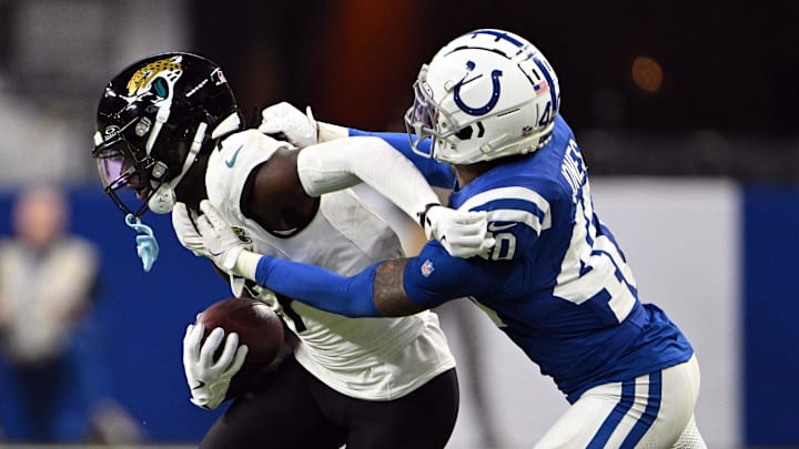 Jan 5, 2025; Indianapolis, Indiana, USA; Indianapolis Colts cornerback Jaylon Jones (40) tackles Jacksonville Jaguars wide receiver Brian Thomas Jr. (7) during the second half at Lucas Oil Stadium. Mandatory Credit: Marc Lebryk-Imagn Images