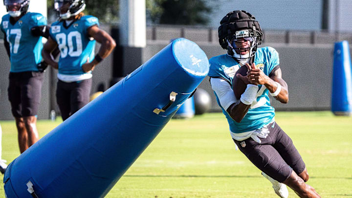 Jacksonville Jaguars wide receiver Travis Hunter (12) rounds a tackling dummy after hauling in a pass during an NFL training camp session ten at the Miller Electric Center, Tuesday, Aug. 5, 2025, in Jacksonville, Fla. [Doug Engle/Florida Times-Union]