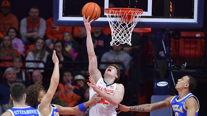 Feb 11, 2025; Champaign, Illinois, USA;  Illinois Fighting Illini guard Kasparas Jakucionis (32) drives to the basket during the second half against the UCLA Bruins at State Farm Center. Mandatory Credit: Ron Johnson-Imagn Images