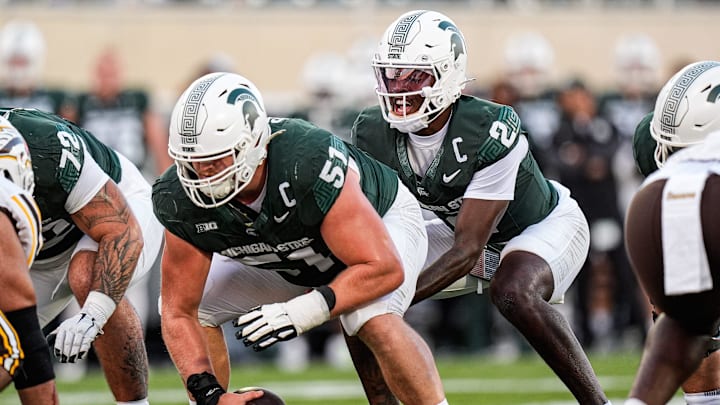 Michigan State quarterback Aidan Chiles (2) calls for a snap from offensive lineman Matt Gulbin (51) against Western Michigan during the first half at Spartan Stadium in East Lansing on Friday, August 29, 2025.