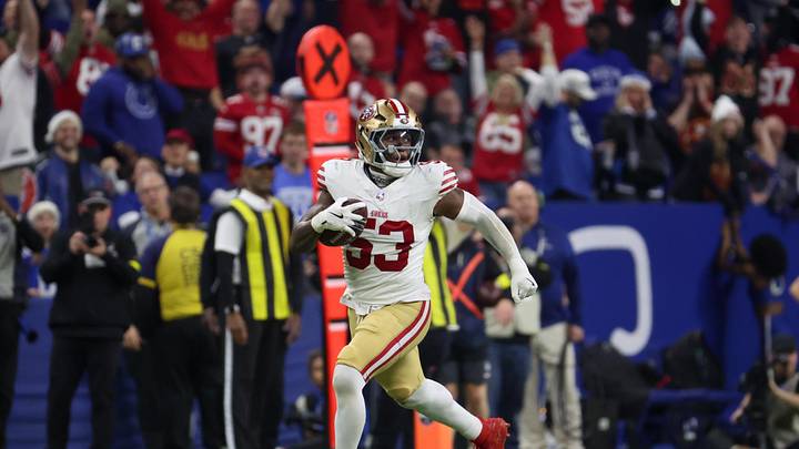 Dec 22, 2025; Indianapolis, Indiana, USA; San Francisco 49ers linebacker Dee Winters (53) carries the ball after an interception for a touchdown against the Indianapolis Colts in the fourth quarter of the game at Lucas Oil Stadium. Mandatory Credit: Trevor Ruszkowski-Imagn Images