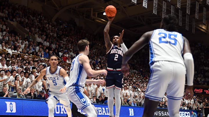 Nov 10, 2023; Durham, North Carolina, USA;  Arizona Wildcats guard Caleb Love (2) shoots over Duke Blue Devils center Kyle Filipowski(30) during the first half at Cameron Indoor Stadium. Mandatory Credit: Rob Kinnan-Imagn Images