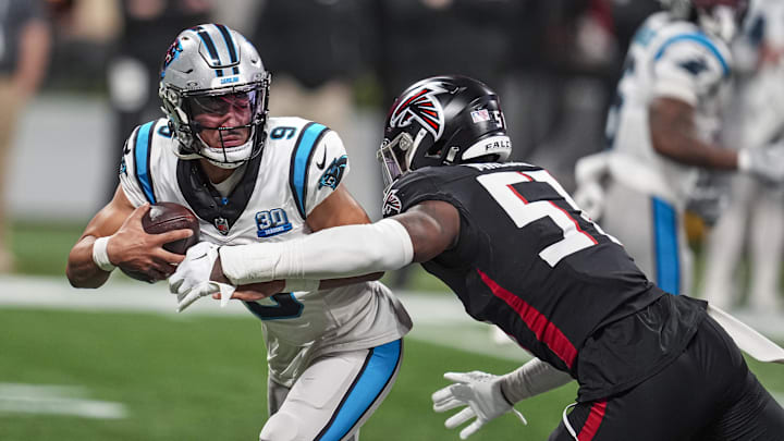 Jan 5, 2025; Atlanta, Georgia, USA; Carolina Panthers quarterback Bryce Young (9) tries to escape the pressure from Atlanta Falcons linebacker DeAngelo Malone (51) during the second half at Mercedes-Benz Stadium. Mandatory Credit: Dale Zanine-Imagn Images Jan 5, 2025; Atlanta, Georgia, USA; Carolina Panthers quarterback Bryce Young (9) tries to escape the pressure from Atlanta Falcons linebacker DeAngelo Malone (51) during the second half at Mercedes-Benz Stadium. Mandatory Credit: Dale Zanine-Imagn Images