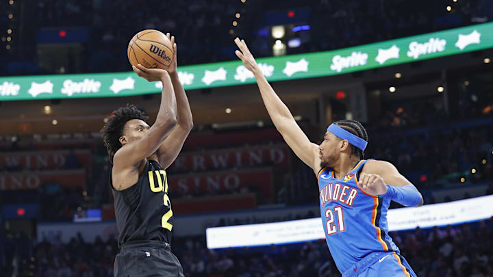 Mar 20, 2024; Oklahoma City, Oklahoma, USA; Utah Jazz guard Collin Sexton (2) shoots as Oklahoma City Thunder guard Aaron Wiggins (21) defends during the second half at Paycom Center. Mandatory Credit: Alonzo Adams-Imagn Images