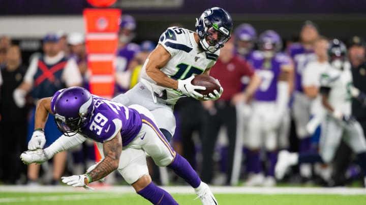 Aug 18, 2019; Minneapolis, MN, USA; Seattle Seahawks wide receiver John Ursua (15) avoids a tackle by Minnesota Vikings safety Marcus Epps (39) at U.S. Bank Stadium.