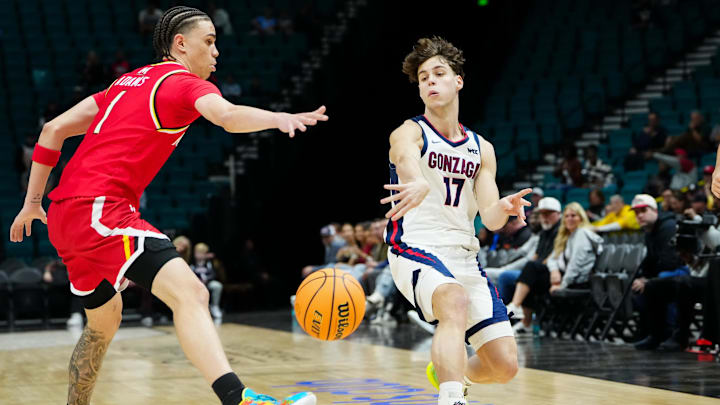 Nov 25, 2025; Las Vegas, NV, USA; Gonzaga Bulldogs guard Mario Saint-Supéry (17) passes while Maryland Terrapins guard Darius Adams (1) defends in the first half in a 2025 Players Era Festival group play game at MGM Grand Garden Arena.