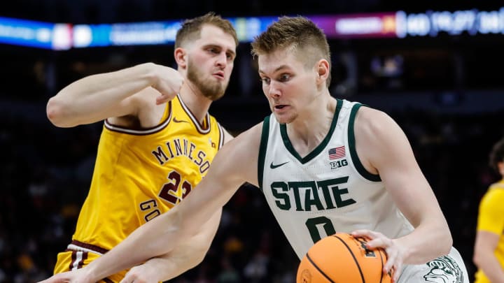 Michigan State forward Jaxon Kohler (0) dribbles against Minnesota forward Parker Fox (23) during the second half of Second Round of Big Ten tournament at Target Center in Minneapolis, Minn. on Thursday, March 14, 2024. Michigan State forward Jaxon Kohler (0) dribbles against Minnesota forward Parker Fox (23) during the second half of Second Round of Big Ten tournament at Target Center in Minneapolis, Minn. on Thursday, March 14, 2024.